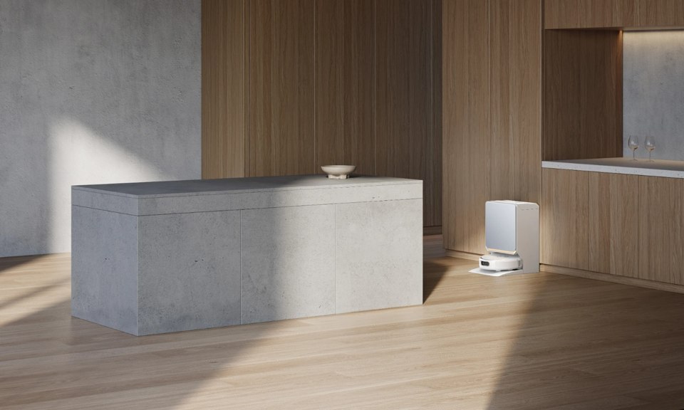 White Narwal Flow 2 vacuum and docking station in a modern kitchen