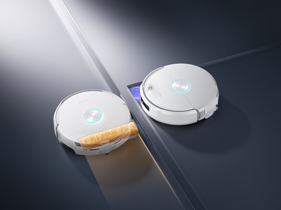 White Narwal Flow 2 robot vacuum showing the rolling mop mechanism